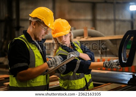 actory engineer workers standing to control panel switch. people works at heavy machine at industry factory. with machinery equipment plant technology. smart industry worker operating. Royalty-Free Stock Photo #2362163105