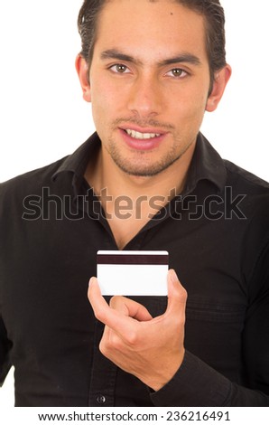 closeup portrait of handsome young man holding credit card isolated on white
