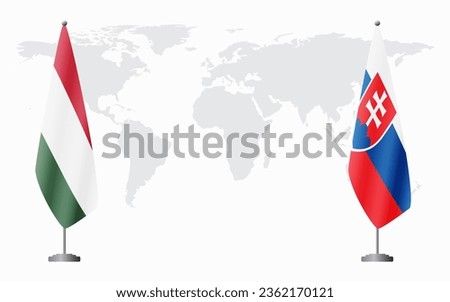 Hungary and Slovakia flags for official meeting against background of world map.