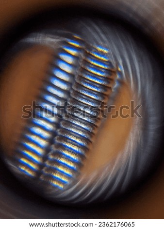 metal screw photographed on a phone with a lens. Macro