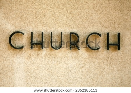 Church. Metal Church Sign. Christian Church Sign on the wall of a building. Welcome sign. Sign at a church. Christian House of Worship. Christian icon. God's House. House of God. Religion. Signage. 