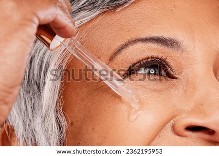 Beauty face, mature woman or serum skincare hydration, anti aging collagen or studio essential oil. Retinol dropper, closeup skin texture or eye of model with facial cosmetic care on white background Royalty-Free Stock Photo #2362195953