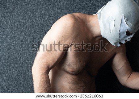 Abstract profile shot of a white man in lucha mask, emotion, depression mental health theme, wrestling sport, struggle
