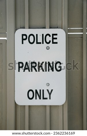 Police Parking Only. Parking Sign. Parking Lot Sign. Room for text. Police parking sign. No Public. Police Only Sign. Police Cars Only. Private Lot. Information. Restricted. Do not enter. Private. 
