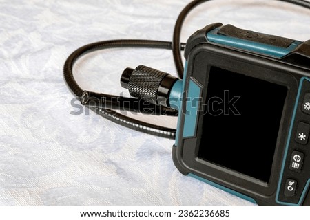 Endoscope camera on the table. Flexible inspection camera. Banner view Royalty-Free Stock Photo #2362236685