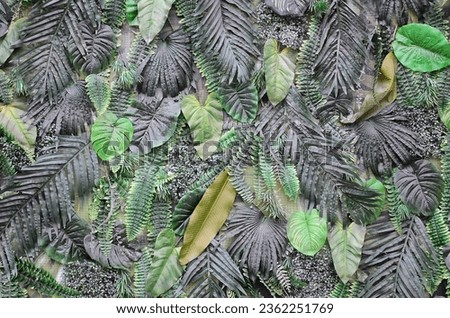Tropical green leaves background, fern, palm and Monstera Deliciosa leaf on wall. Floral jungle pattern concept background close up