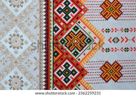 Traditional Ukrainian folk art knitted embroidery pattern on textile fabric. Colored pixel design knitted canvas.