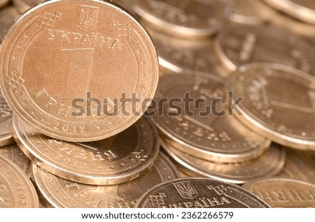 Large pile of big golden coins. Financial success money background for rich life concepts, banking and profit in Ukraine