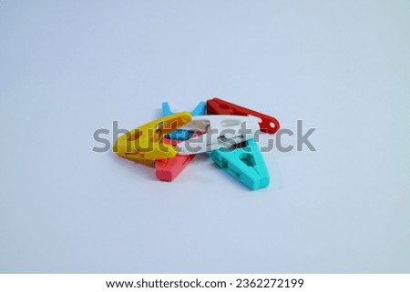 A group of colorful clothespins isolated on a white background.