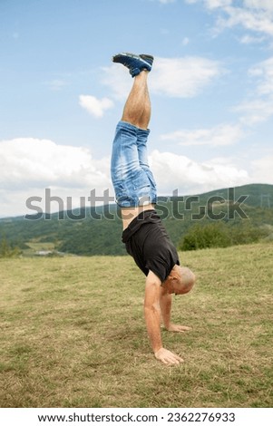 Man practicing handstand stock photo