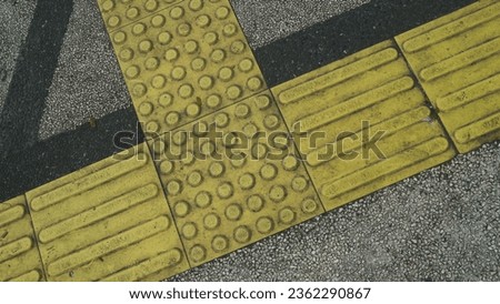 Tactile Paving on Modern Tiles Pathway for Blind Handicap, Signs for the blind path