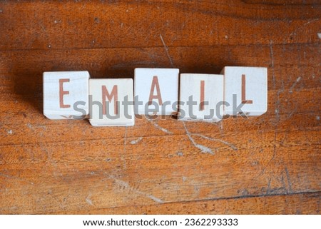 Photo of wooden blocks that make up the vocabulary "EMAIL" in English