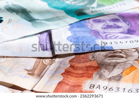 Detail photo of Colombian bills of twenty thousand, fifty thousand and one hundred thousand pesos, horizontal photograph