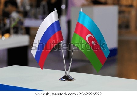 Flags of Russia and Azerbaijan together at some event or fair. Flags of the two countries as a symbol of cooperation between states. Joint business of Azerbaijan and the Russian Federation Royalty-Free Stock Photo #2362296529