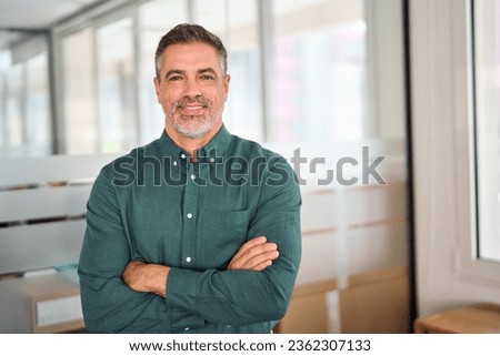 Smiling 40 years old middle aged business man in office, portrait. Confident older bank manager or investor, mid adult businessman boss, successful professional Indian entrepreneur looking at camera. Royalty-Free Stock Photo #2362307133