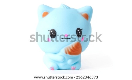 Colorful rubber toy cat isolated on white background. High quality photo