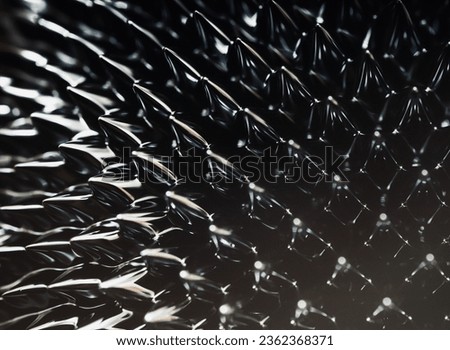 Ferrofluid black spikes. Reaction to a magnetic field. Minimalistic futuristic macro photo. Royalty-Free Stock Photo #2362368371