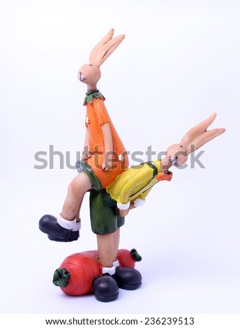 Statue of cute rabbit girl sitting on rabbit boy's back, symbolizing friendship, help and support.