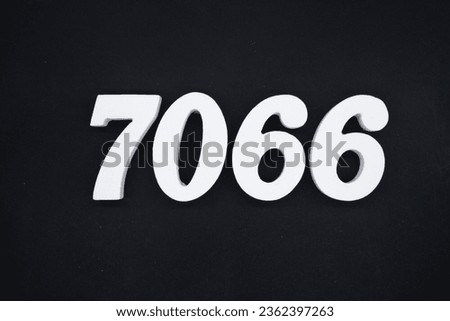 Black for the background. The number 7066 is made of white painted wood.