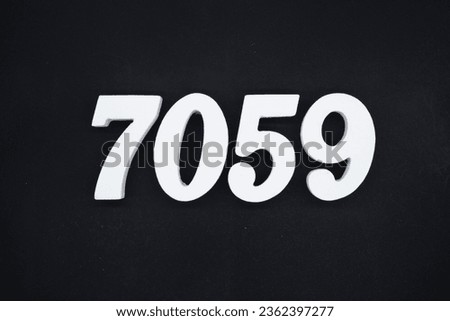 Black for the background. The number 7059 is made of white painted wood.