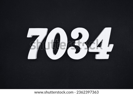Black for the background. The number 7034 is made of white painted wood.