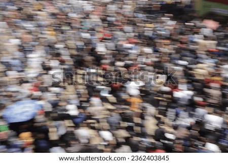 Blurry picture people in the crowd celebrating the Ya Qowiyyu festival which is located in Klaten