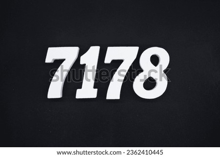 Black for the background. The number 7178 is made of white painted wood.