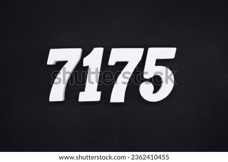 Black for the background. The number 7175 is made of white painted wood.