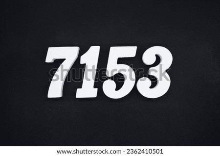 Black for the background. The number 7153 is made of white painted wood.