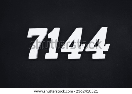 Black for the background. The number 7144 is made of white painted wood.