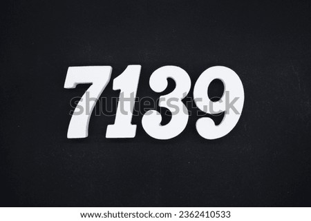 Black for the background. The number 7139 is made of white painted wood.