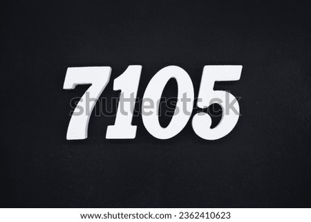 Black for the background. The number 7105 is made of white painted wood.