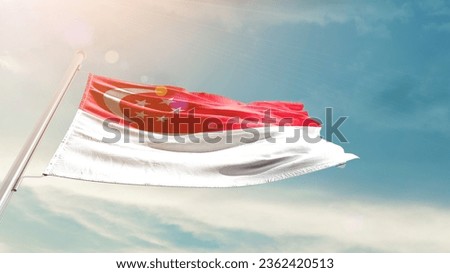 Singapore national flag waving in beautiful sky.