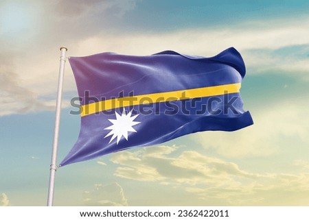 Nauru national flag waving in beautiful sky.