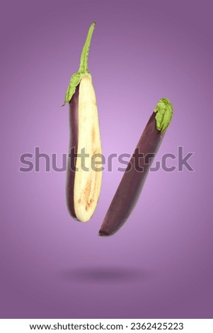 Eggplant isolated on a white background. Fresh Flying aubergine. Royalty-Free Stock Photo #2362425223