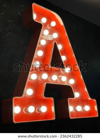 Letter A signage with bulbs. 