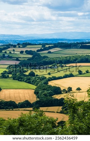 A view of what you see when looking out from Major's Leap on Wenlock Edge in Shropshire. A beautiful patchwork of classic English-Welsh countryside.  Royalty-Free Stock Photo #2362436459