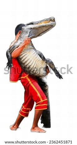 a photography of a man holding a large alligator in his arms, bowed man holding a large alligator in his arms.
