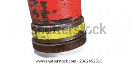 a photography of a stack of three red and yellow fire hydrants, oil filterr with red and yellow stripes on top of it.