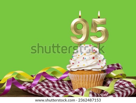 Birthday Cake With Candle Number 95 - On Green Background. Royalty-Free Stock Photo #2362487153