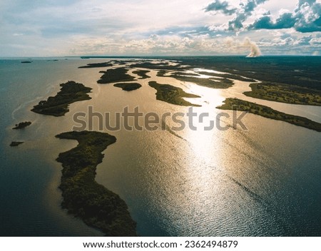 Parana River or Rio Parana with its river islands during sunset time in the border of the states of Sao Paulo and Mato Grosso do Sul - Brazil Royalty-Free Stock Photo #2362494879