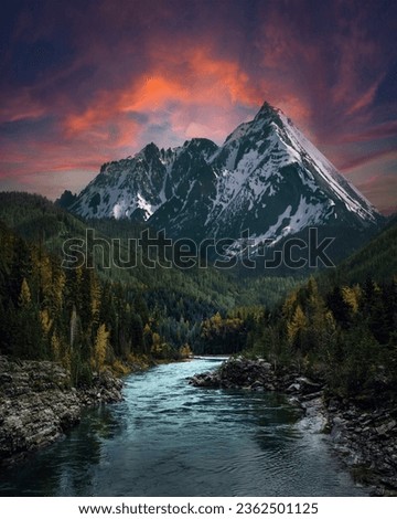 Mountain landscape with a river and a beautiful sky at sunset. Royalty-Free Stock Photo #2362501125