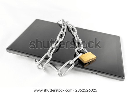 Tablet terminal, chain and padlock. image of security