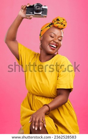 Studio camera, photographer and happy black woman excited for lens photo, content creation or photography. Creative photoshoot, equipment and talent with African person smile on pink background
