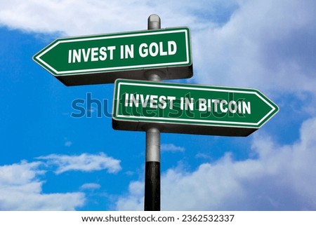 Two direction signs, one pointing left (Invest in gold) and the other one, pointing right (Invest in bitcoin). Royalty-Free Stock Photo #2362532337