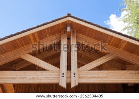 New wooden truss structure called palladian truss with beams and wooden roof  Royalty-Free Stock Photo #2362534405