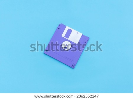 A floppy disk isolated on blue background. After some edits.