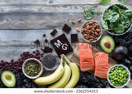 An assortment of food high in magnesium with the element symbol MG. Royalty-Free Stock Photo #2362554313