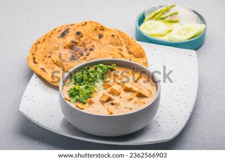 Delicious and creamy shahi paneer with roti and green salad Royalty-Free Stock Photo #2362566903