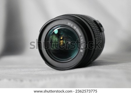 Camera lens with lens reflection, isolated on white